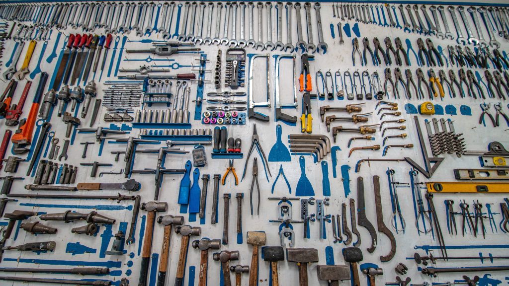 Image of tools all arranged by size and location, with painted tool-shaped spots where tools are missing.